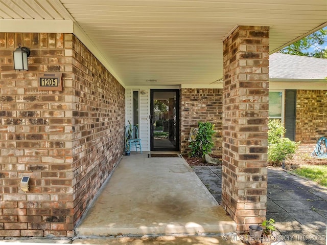 1205 Beaverly, Ardmore, OK 73401 - view of exterior entry with brick siding and covered porch