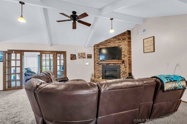 1205 Beaverly, Ardmore, OK 73401 - carpeted living room featuring a ceiling fan and a brick fireplace