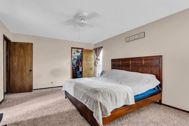 1205 Beaverly, Ardmore, OK 73401 - carpeted bedroom with baseboards, ceiling fan, a closet, and a spacious closet