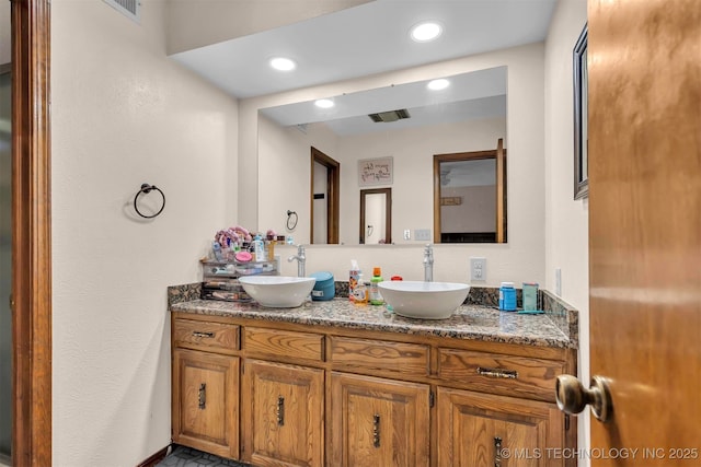 1205 Beaverly, Ardmore, OK 73401 - bathroom featuring double vanity and recessed lighting