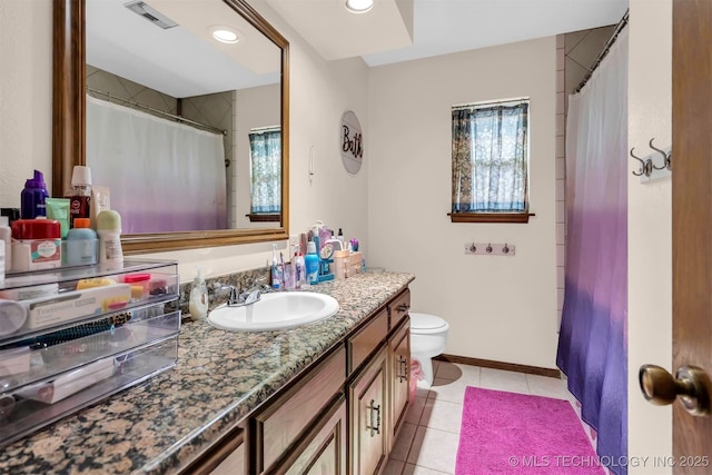 1205 Beaverly, Ardmore, OK 73401 - full bath featuring tile patterned flooring, vanity, toilet, recessed lighting, and baseboards