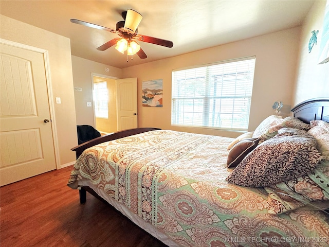 114537 Spring Creek Rd, Eufaula, OK 74432 - bedroom with wood finished floors, multiple windows, and a ceiling fan
