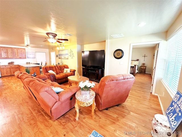 114537 Spring Creek Rd, Eufaula, OK 74432 - living room featuring light wood-type flooring, ceiling fan, and baseboards