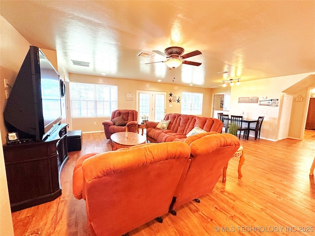 114537 Spring Creek Rd, Eufaula, OK 74432 - living area with light wood finished floors, a ceiling fan, track lighting, and baseboards