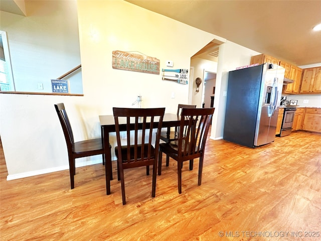 114537 Spring Creek Rd, Eufaula, OK 74432 - dining area with light wood-type flooring and baseboards