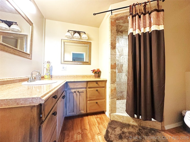 114537 Spring Creek Rd, Eufaula, OK 74432 - full bath with a tile shower, wood finished floors, vanity, and toilet