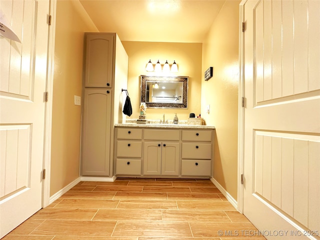 114537 Spring Creek Rd, Eufaula, OK 74432 - bathroom featuring wood finish floors, vanity, and baseboards