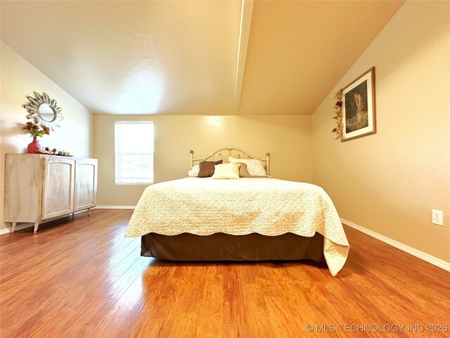 114537 Spring Creek Rd, Eufaula, OK 74432 - bedroom with vaulted ceiling, light wood-style flooring, and baseboards