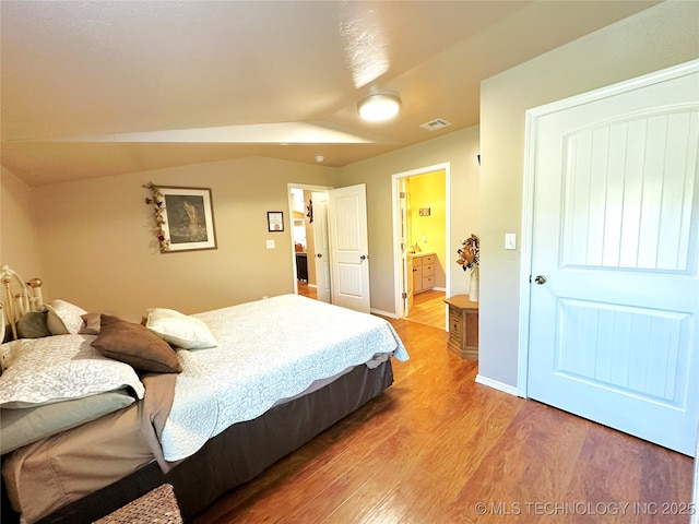 114537 Spring Creek Rd, Eufaula, OK 74432 - bedroom with light wood-type flooring, lofted ceiling, and ensuite bathroom