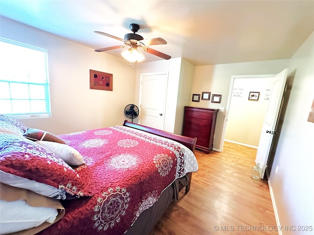 114537 Spring Creek Rd, Eufaula, OK 74432 - bedroom with light wood-style floors, baseboards, and a ceiling fan