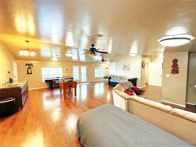 114537 Spring Creek Rd, Eufaula, OK 74432 - bedroom featuring light wood-style flooring, baseboards, a chandelier, and billiards table