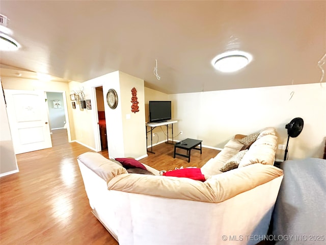 114537 Spring Creek Rd, Eufaula, OK 74432 - living area with wood finished floors, baseboards, and vaulted ceiling