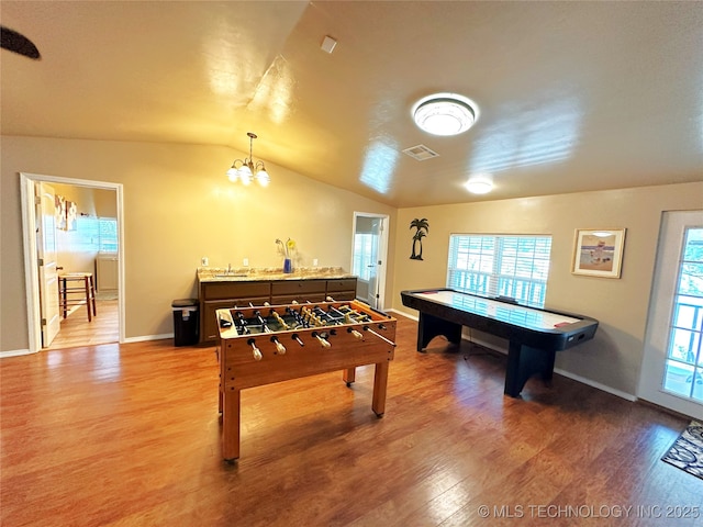 114537 Spring Creek Rd, Eufaula, OK 74432 - rec room with light wood finished floors, lofted ceiling, a chandelier, and baseboards