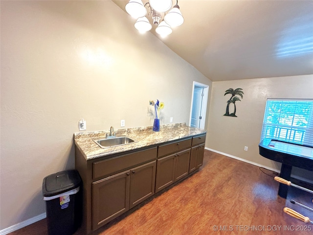 114537 Spring Creek Rd, Eufaula, OK 74432 - kitchen with vaulted ceiling, a sink, wood finished floors, a chandelier, and gray cabinets