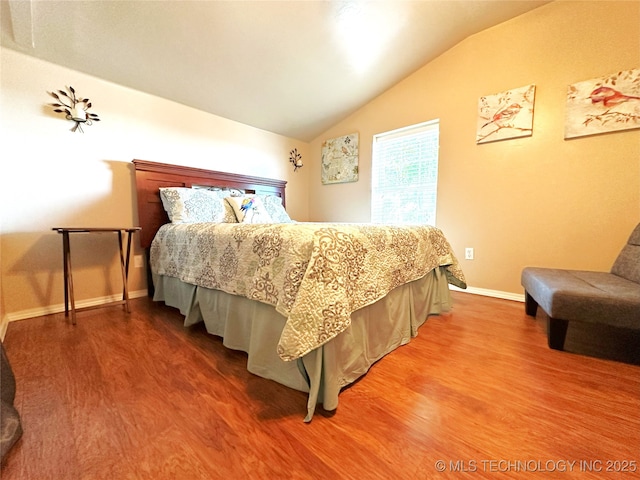 114537 Spring Creek Rd, Eufaula, OK 74432 - bedroom with wood finished floors, vaulted ceiling, and baseboards