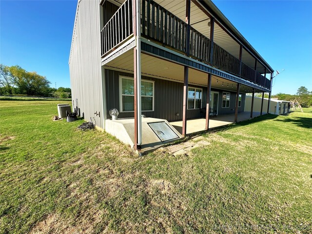 114537 Spring Creek Rd, Eufaula, OK 74432 - back of property with a lawn and central AC unit