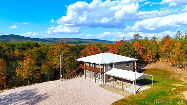 174550 N 4430th Rd N, Nashoba, OK 74558 - aerial view of property and surrounding area with a heavily wooded area and a mountain backdrop