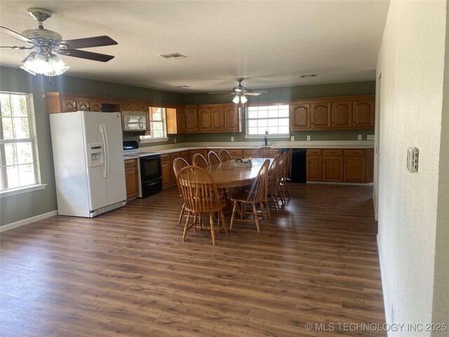 174550 N 4430th Rd N, Nashoba, OK 74558 - dining space featuring ceiling fan, dark wood-style flooring, and baseboards
