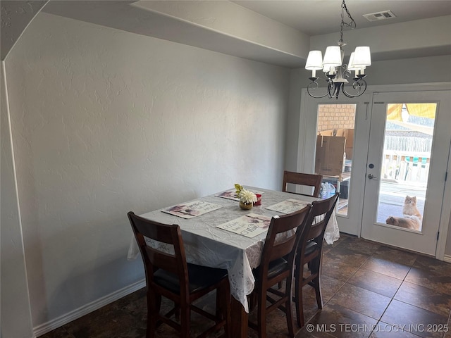 4715 Travertine, Ardmore, OK 73401 - dining space with a chandelier and baseboards