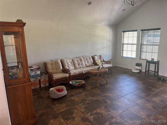4715 Travertine, Ardmore, OK 73401 - living area featuring lofted ceiling and baseboards