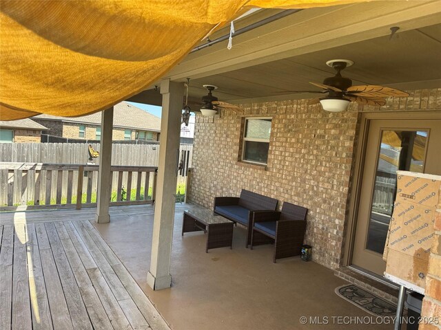 4715 Travertine, Ardmore, OK 73401 - wooden terrace featuring a ceiling fan, fence, and a patio area