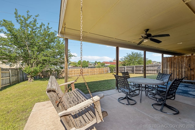 view of patio with a ceiling fan and outdoor dining area