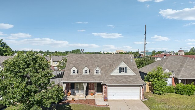 view of front of house featuring brick siding, concrete driveway, roof with shingles, and a garage