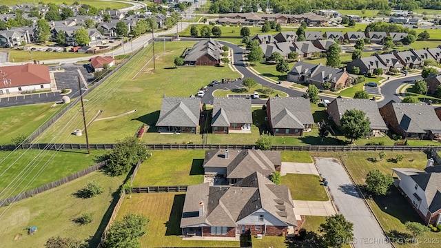 aerial view of property and surrounding area with nearby suburban area