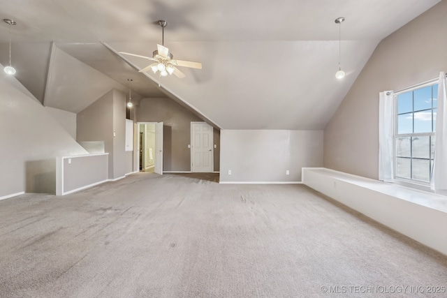bonus room with lofted ceiling, ceiling fan, carpet floors, and baseboards