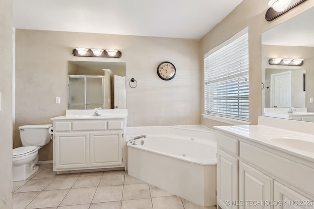 bathroom with healthy amount of natural light, a shower stall, tile patterned floors, and a garden tub