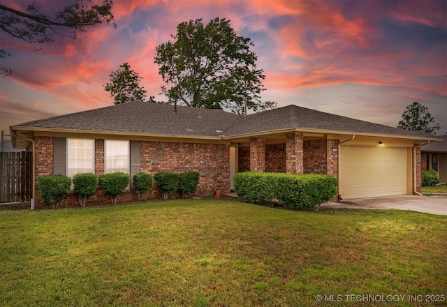 view of front of home featuring driveway, an attached garage, and brick siding