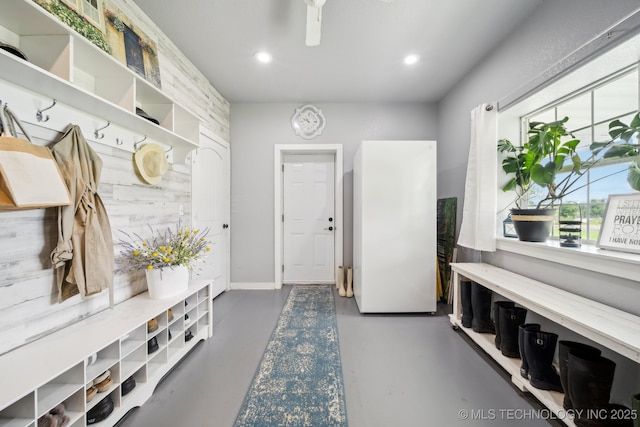 mudroom with concrete flooring and recessed lighting