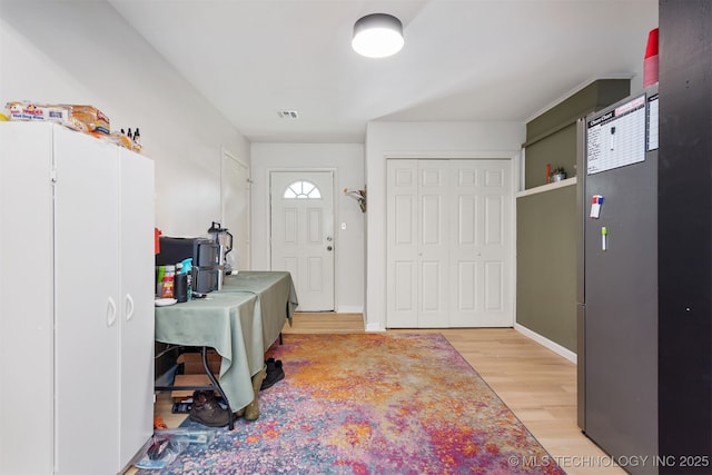 1014 SE 3rd St, Wagoner, OK 74467 - foyer entrance with light wood-style floors and baseboards