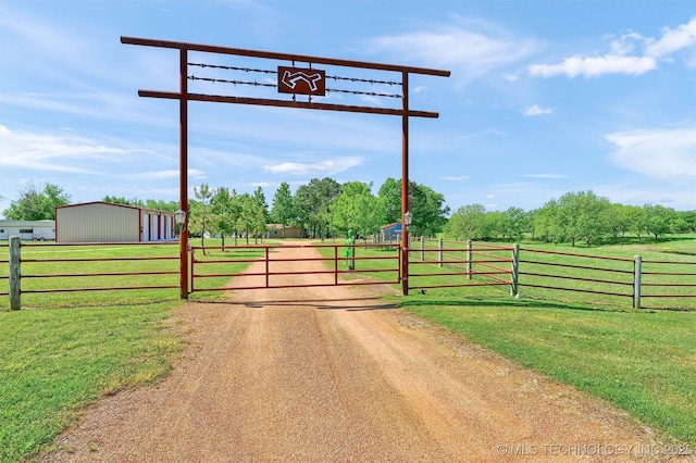 17983 Nuttin Ln, Madill, OK 73446 - view of dirt / gravel driveway with a gate and a view of rural / pastoral area