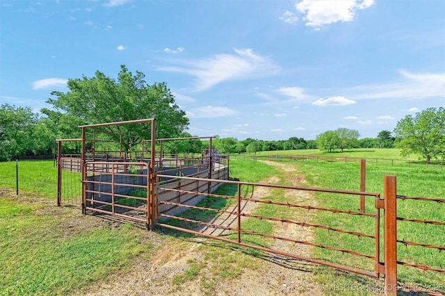 17983 Nuttin Ln, Madill, OK 73446 - gate featuring a view of countryside, an exterior structure, and an outbuilding