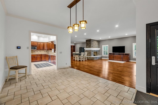 9304 E 113th St S, Bixby, OK 74008 - living room with a fireplace, light wood finished floors, and recessed lighting