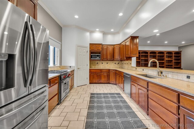 9304 E 113th St S, Bixby, OK 74008 - kitchen featuring appliances with stainless steel finishes, crown molding, tasteful backsplash, brown cabinetry, and recessed lighting