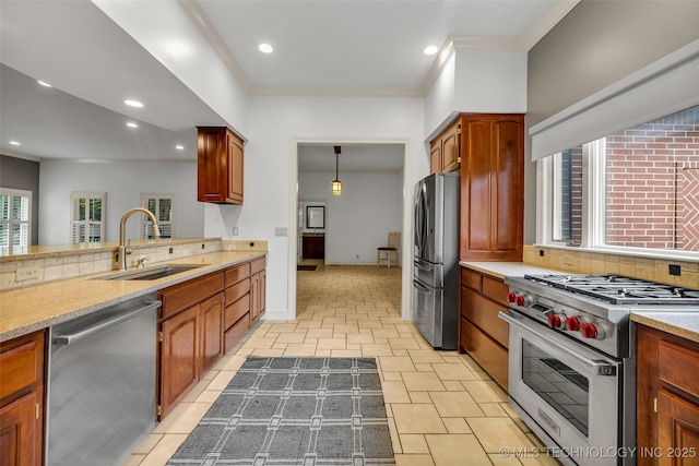 9304 E 113th St S, Bixby, OK 74008 - kitchen with stainless steel appliances, ornamental molding, tasteful backsplash, recessed lighting, and brown cabinets
