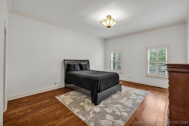 9304 E 113th St S, Bixby, OK 74008 - bedroom featuring ornamental molding and wood finished floors
