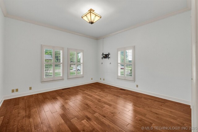 9304 E 113th St S, Bixby, OK 74008 - empty room featuring crown molding and hardwood / wood-style flooring