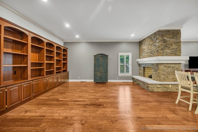 9304 E 113th St S, Bixby, OK 74008 - unfurnished living room with ornamental molding, a fireplace, wood finished floors, and recessed lighting