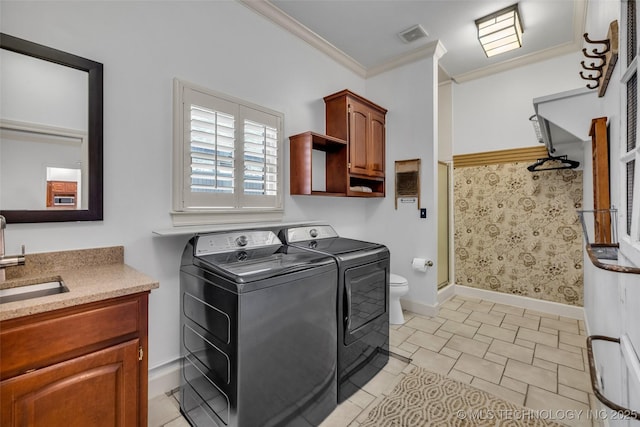 9304 E 113th St S, Bixby, OK 74008 - laundry room with washer and clothes dryer and ornamental molding