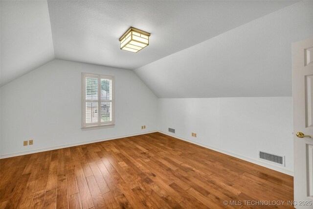 9304 E 113th St S, Bixby, OK 74008 - bonus room with wood finished floors and vaulted ceiling