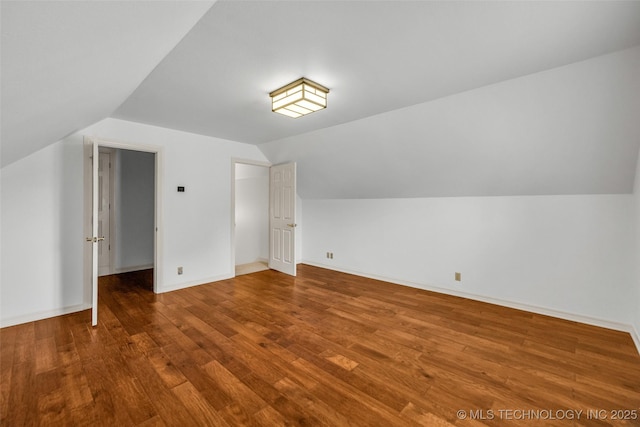 9304 E 113th St S, Bixby, OK 74008 - additional living space with vaulted ceiling and wood finished floors