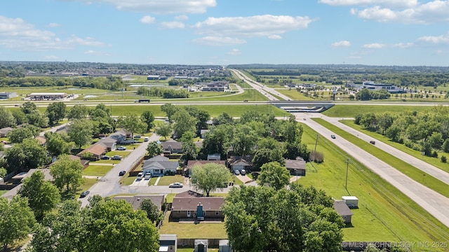 aerial view of residential area featuring a tree filled landscape