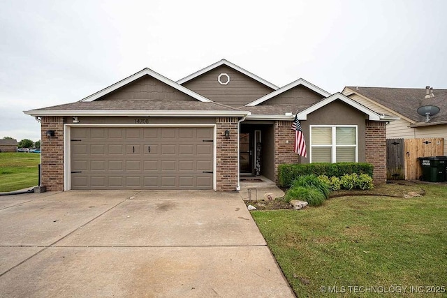 14708 E 108th St N, Owasso, OK 74055 - view of front facade with concrete driveway, an attached garage, brick siding, and a shingled roof