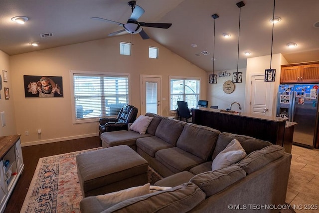 14708 E 108th St N, Owasso, OK 74055 - living room with a ceiling fan, baseboards, and high vaulted ceiling
