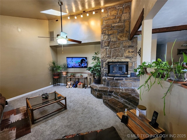 14360 County Road 3505th Loop, Ada, OK 74820 - carpeted living room with a skylight, ceiling fan, baseboards, and track lighting