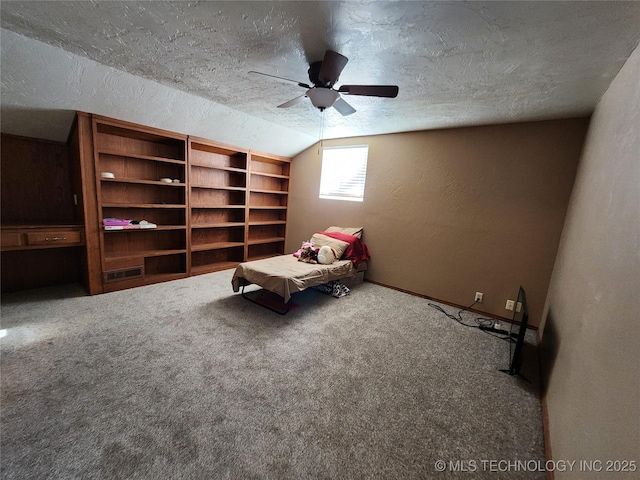 14360 County Road 3505th Loop, Ada, OK 74820 - unfurnished room with ceiling fan, a textured wall, a textured ceiling, carpet flooring, and vaulted ceiling