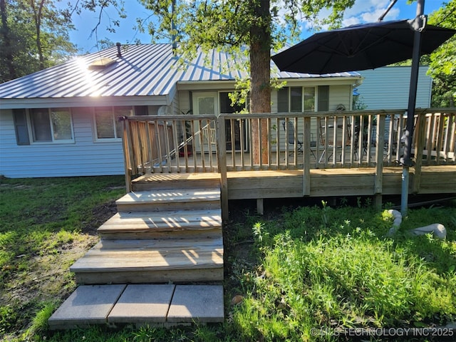 14360 County Road 3505th Loop, Ada, OK 74820 - back of house featuring metal roof, a wooden deck, and a standing seam roof